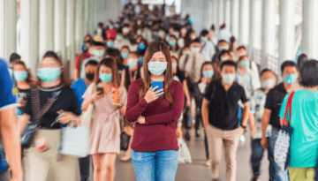 people wearing masks and texting